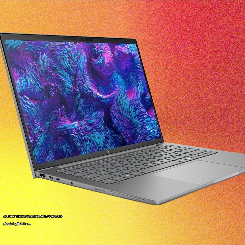 Side view of a silver laptop with abstract blue and purple background on the screen - Fair use review image from https://www.wired.com/review/hp-zbook-8-gli-14-inch/